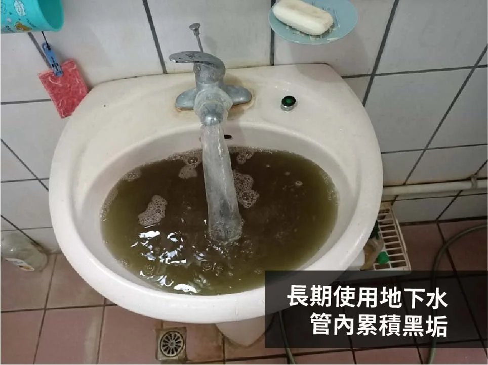 A bathroom sink filled with dirty, murky water caused by long-term underground water pipe buildup.