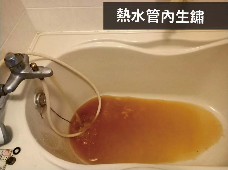 A bathtub filled with dirty, brownish water and a flexible white hose attached to a faucet.