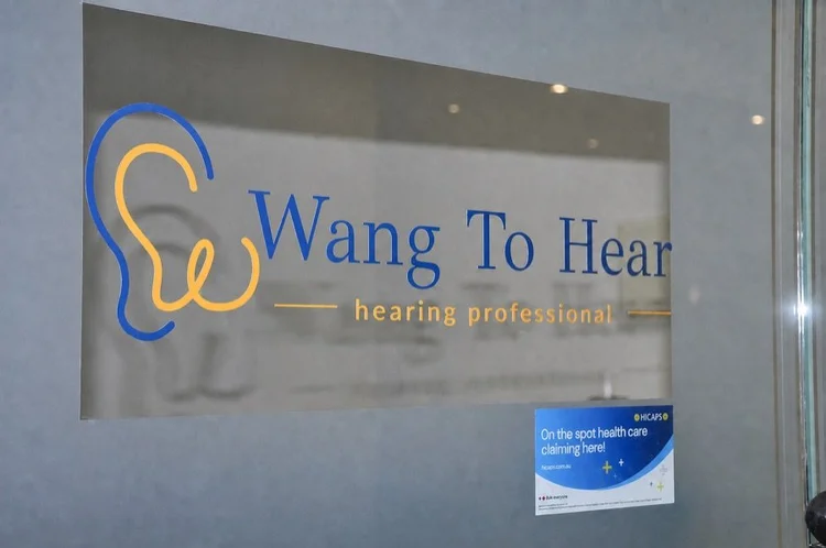 Wang To Hear clinic entrance sign at Suite 412