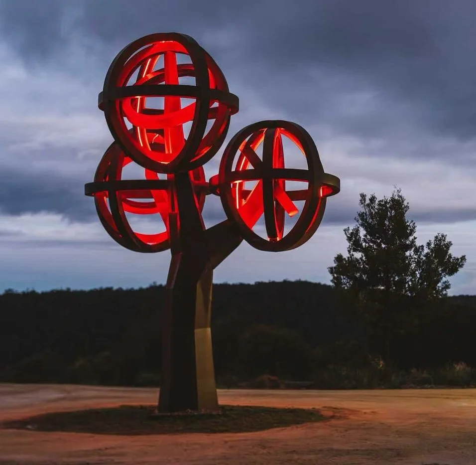 corten steel lit up light tree landscaping at freycinet