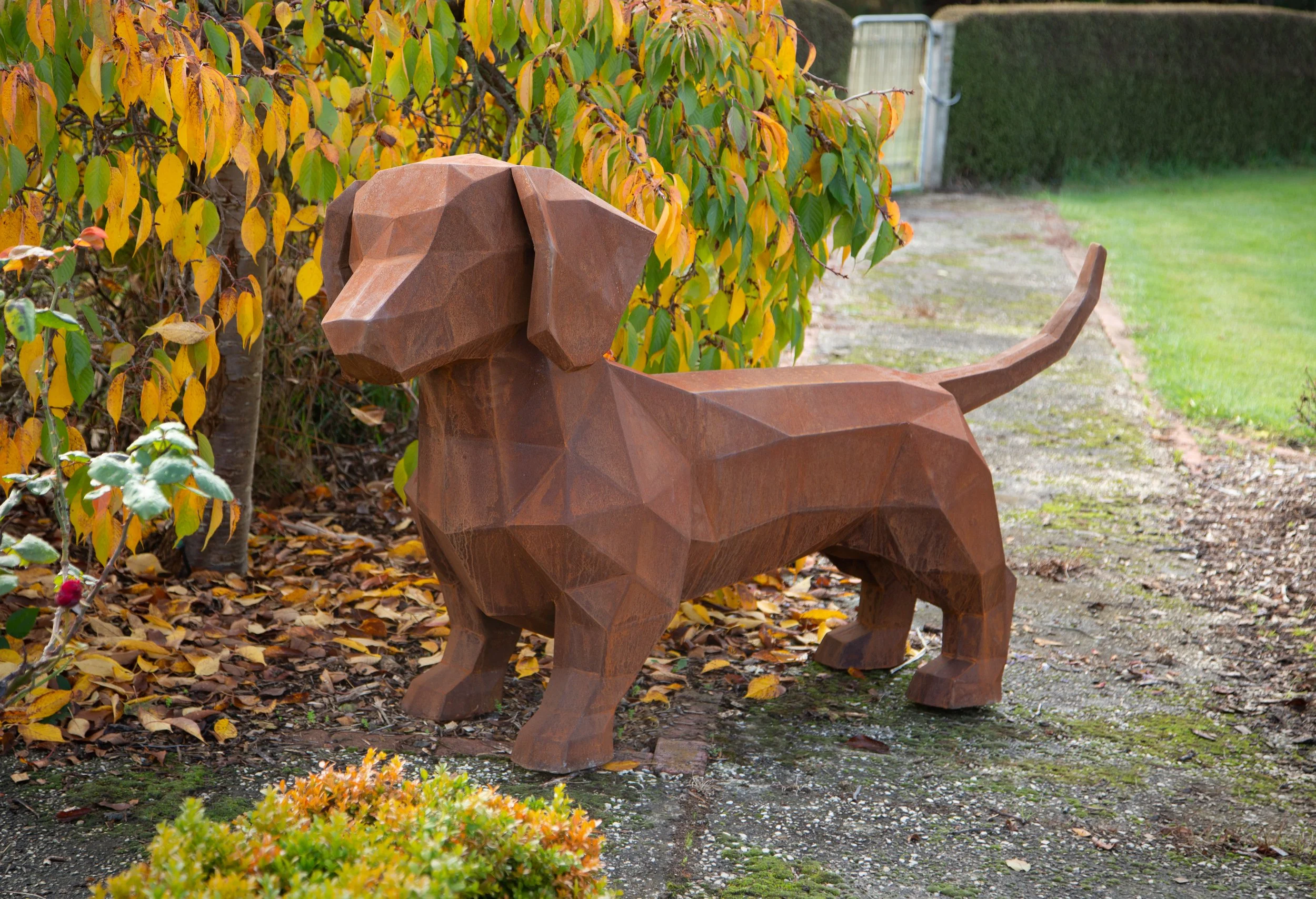 low poly sausage dog corten steel sculpture