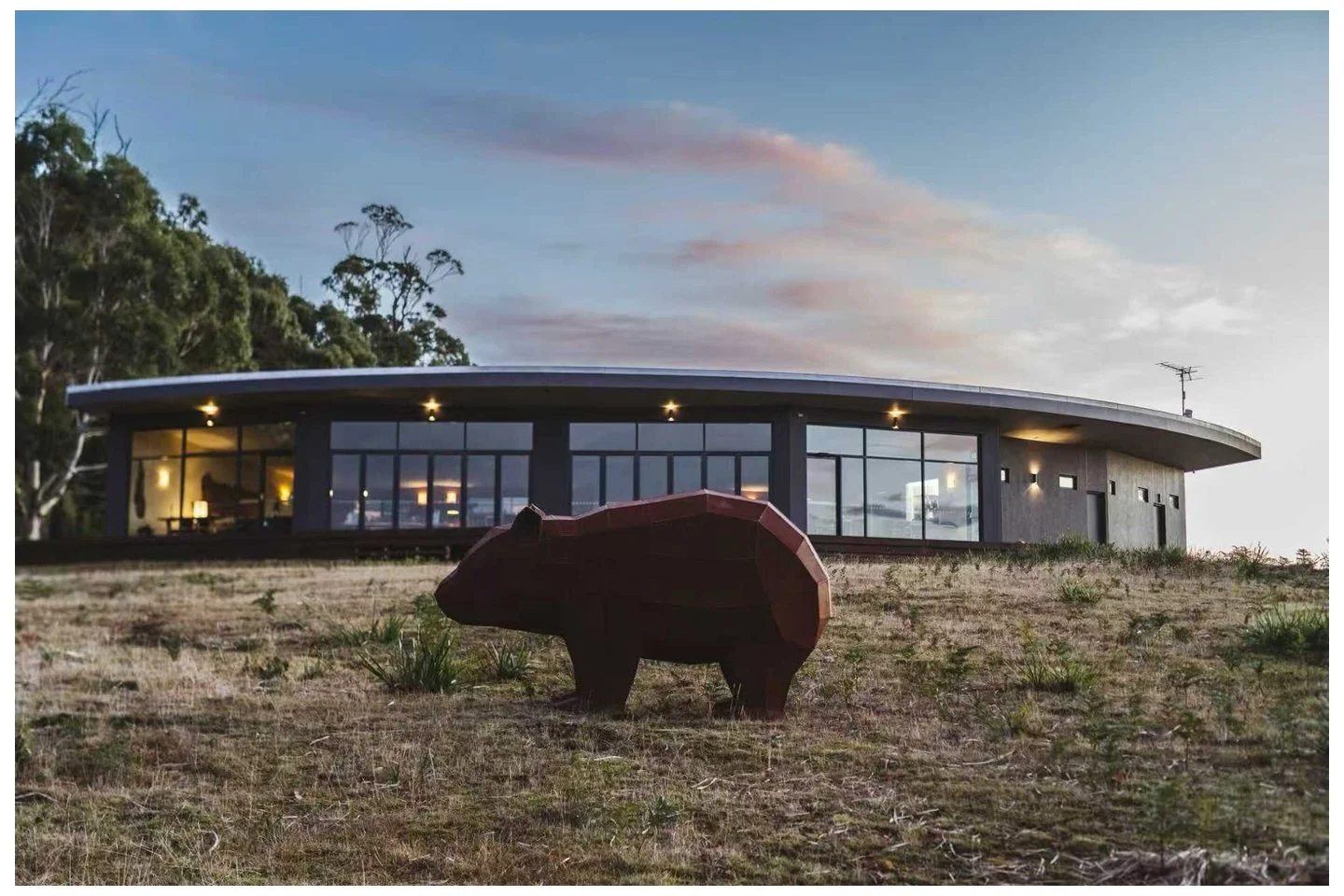 corten steel wombat silhouetted against the freycinet resort tasmania