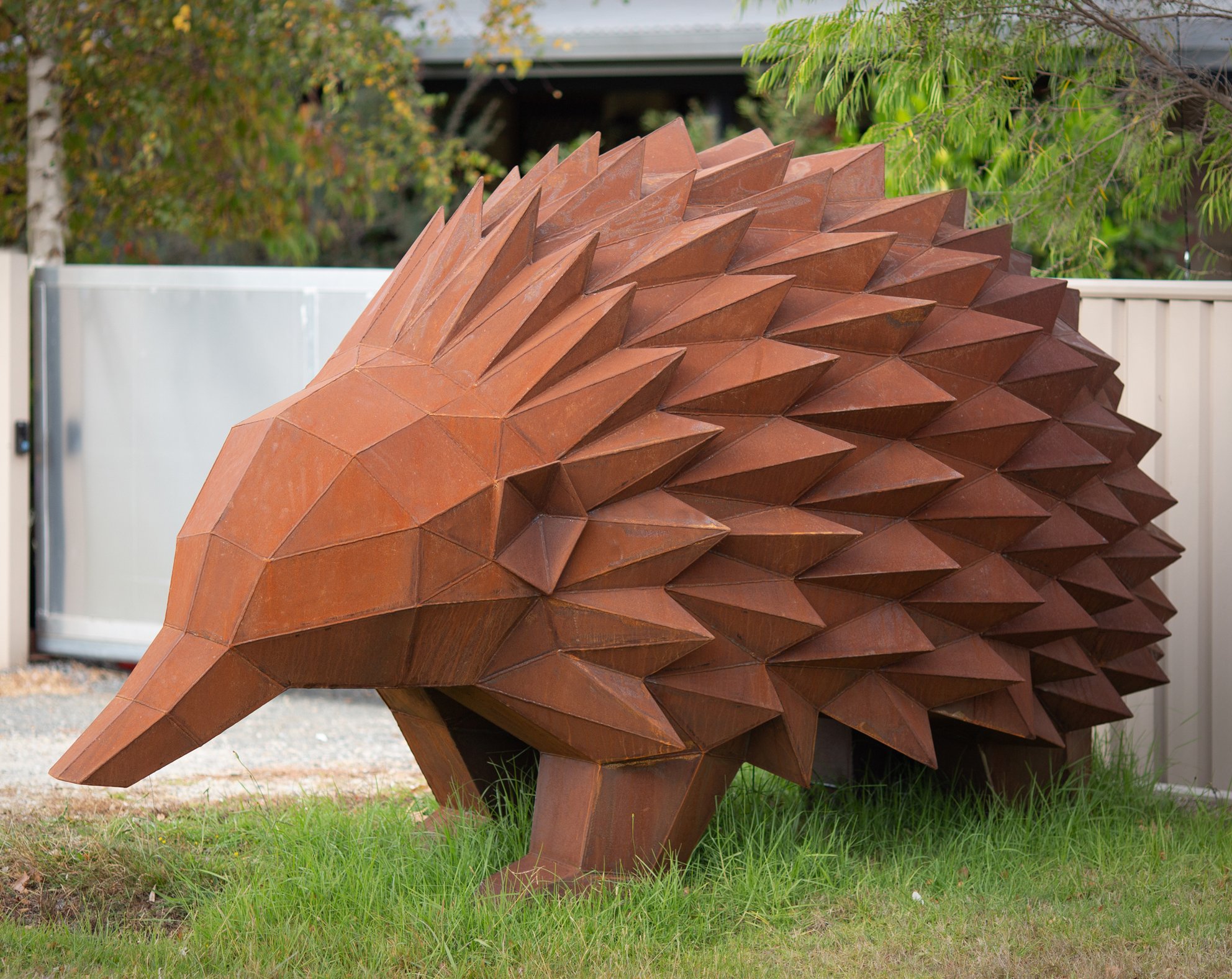 corten steel echidna sculpture low poly