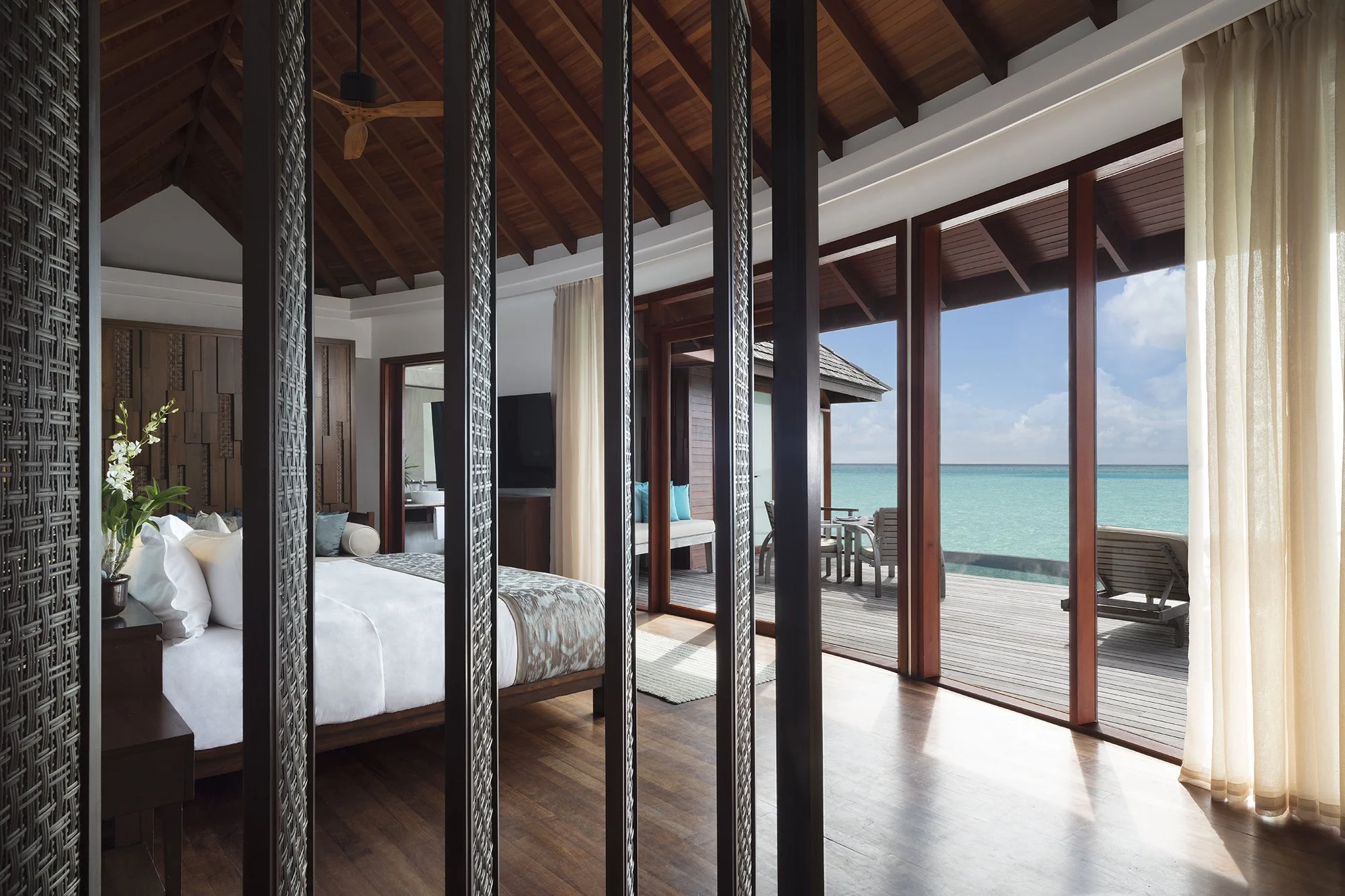 Anantara Dhigu Over Water Suite Bedroom.jpg