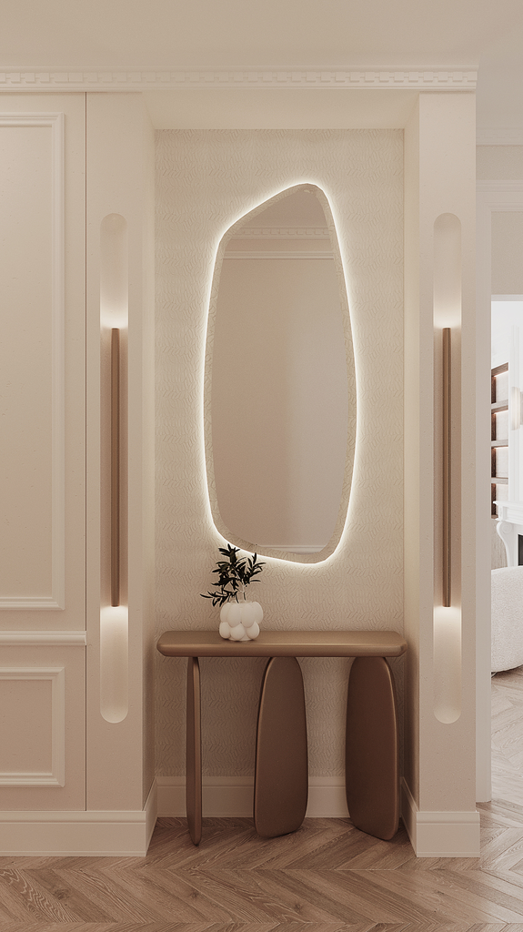 Entrée élégante avec un miroir ombré éclairé, une console en bois classique, et un vase blanc avec des feuilles vertes.