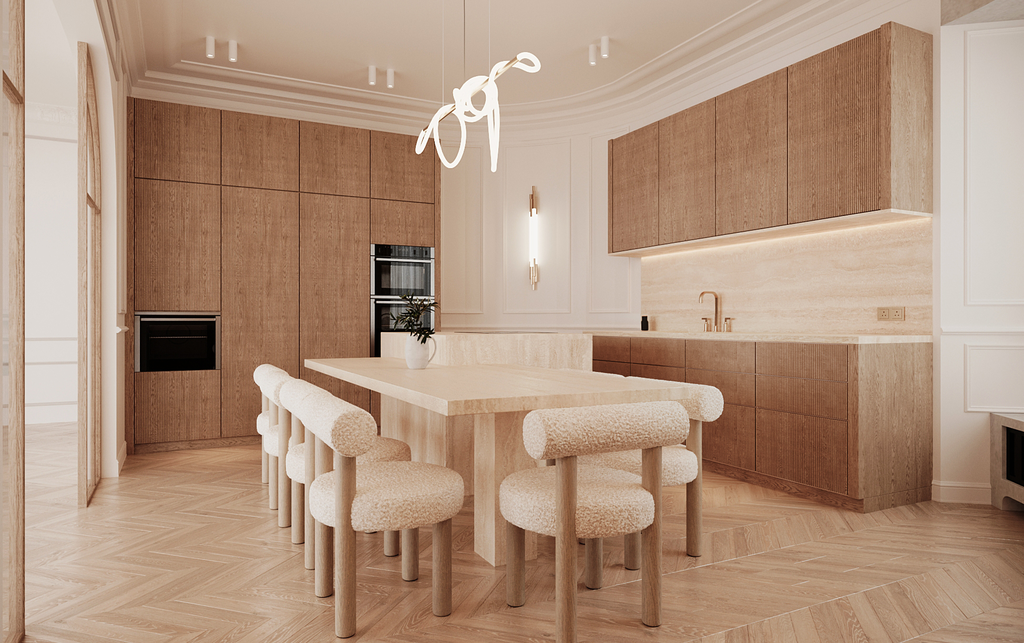 Cuisine moderne avec meubles en bois clair, un plan de travail beige et un îlot central, plusieurs chaises rembourrées autour de l'îlot, éclairage wabi-sabi suspendu, murs gris et bois, ambiance chaleureuse et épurée.