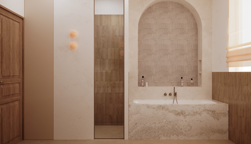 Vue d'une salle de bain avec une baignoire intégrée en pierre, un mur en briques apparentes derrière la baignoire, un mur en bois à droite, et une paroi en verre pour la douche