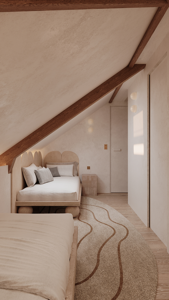 Chambre sous un toit en pente avec deux lits, un tapis rectangulaire beige avec des lignes brunes, murs clairs, lumière naturelle
