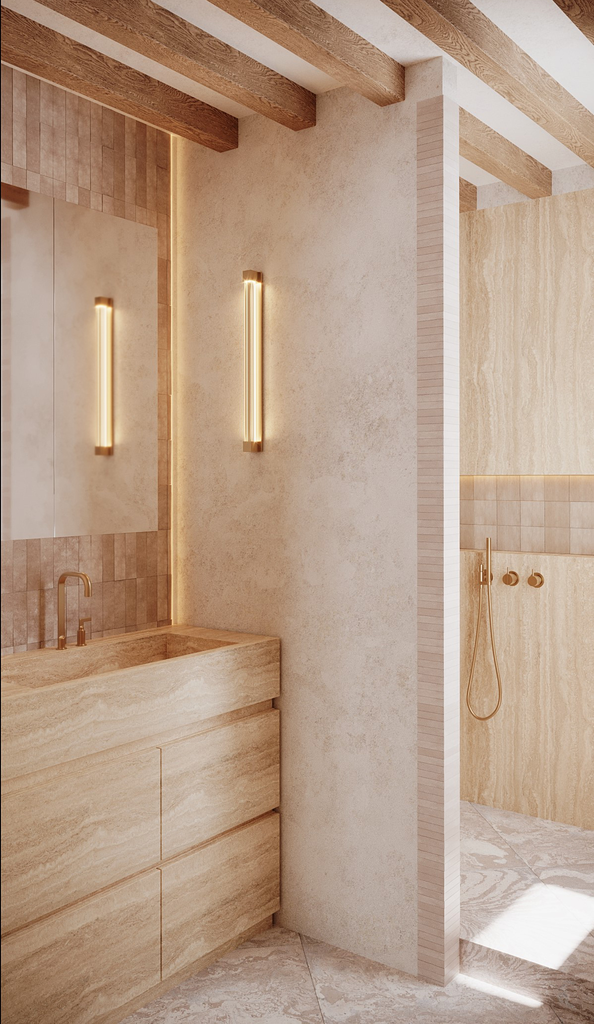 Intérieur d'une salle de bain moderne avec un lavabo en pierre beige, deux appliques lumineuses verticales, et une zone de douche séparée avec une douche à main.