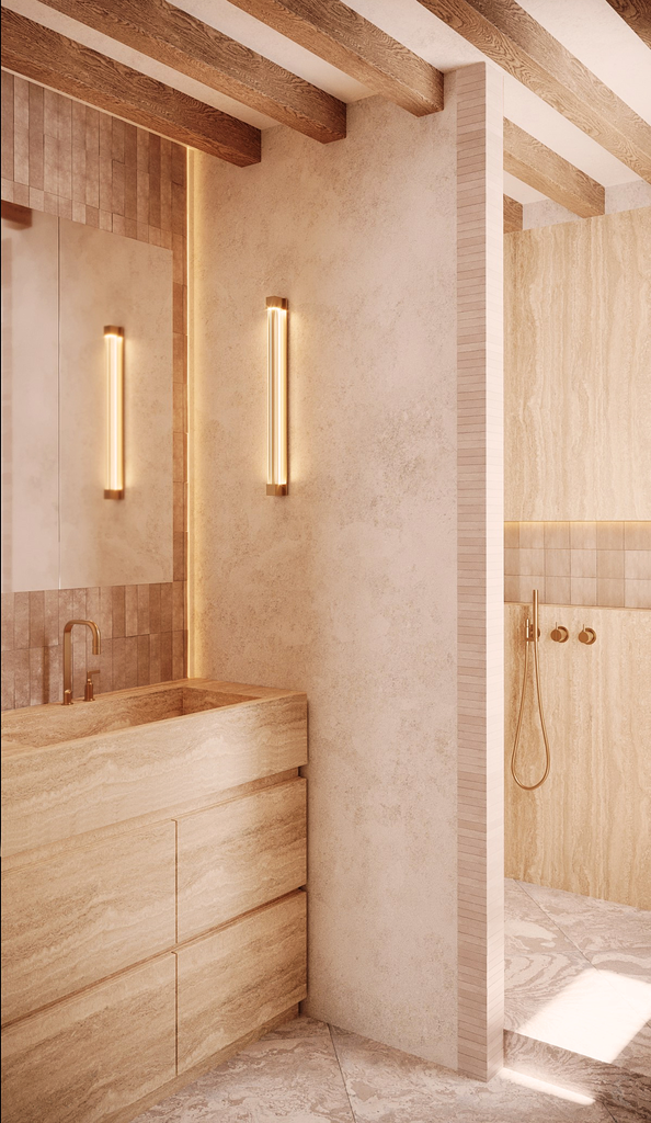 Intérieur d'une salle de bain moderne avec lavabo en pierre, miroirs, éclairage vertical et espace de douche avec parois en pierre.