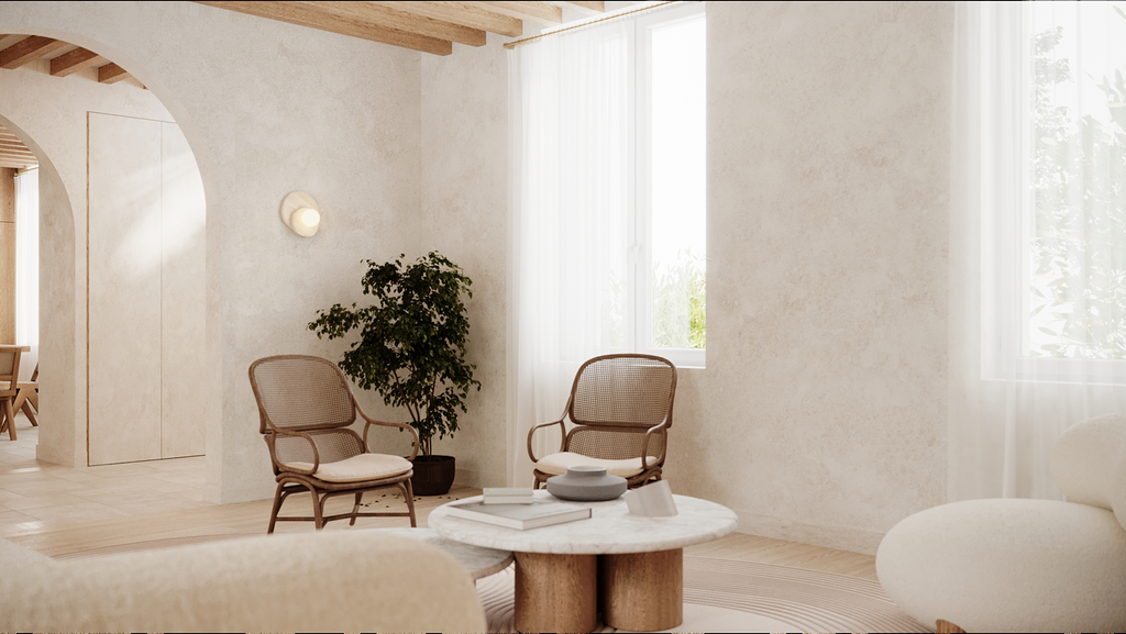 Salon minimaliste avec deux fauteuils en bois, une table basse en marbre, une plante verte et grande fenêtre avec rideaux blancs.