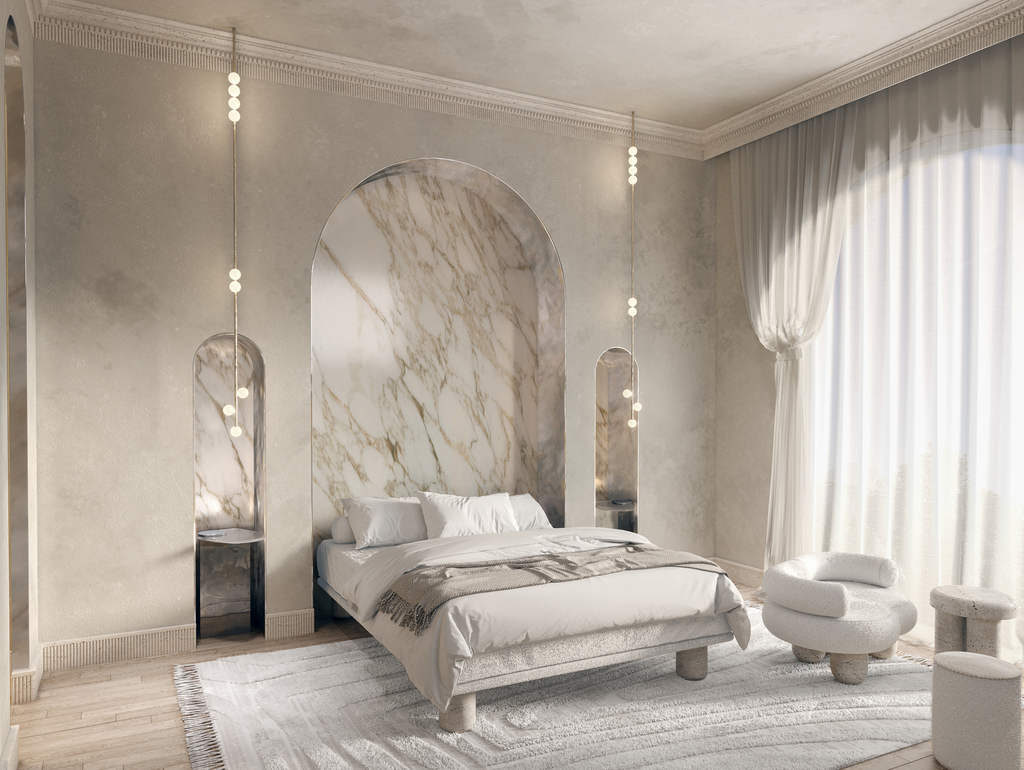 Chambre à coucher élégante avec un lit au centre, entourée de murs en marbre et de rideaux blancs. Décor minimaliste avec mobilier blanc, tapis beige et une grande fenêtre laissant entrer la lumière naturelle.