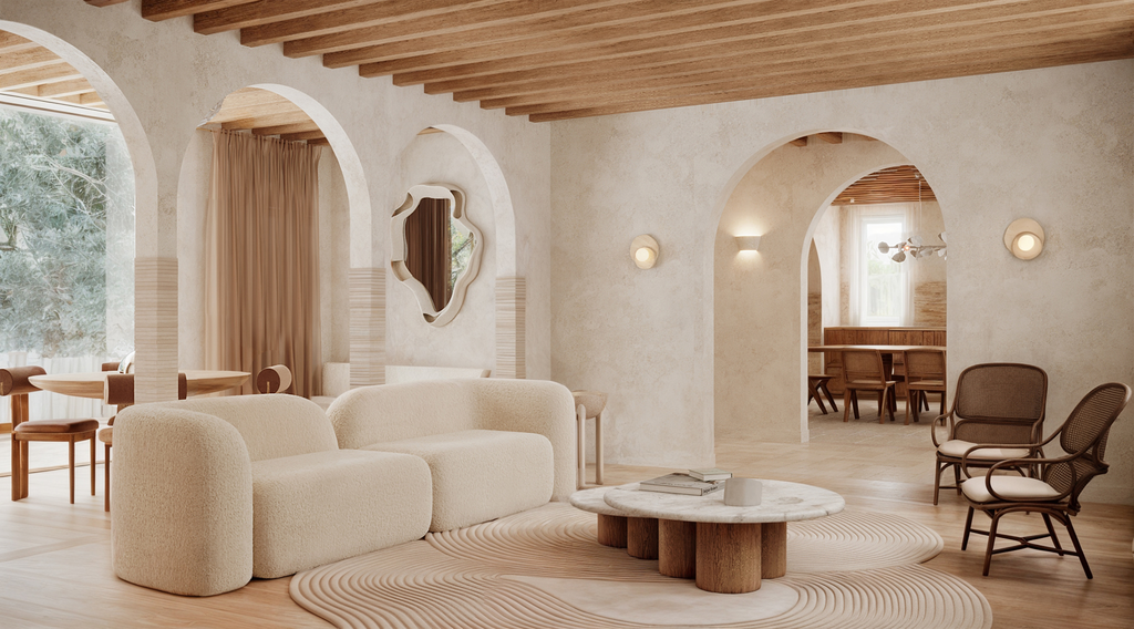 Intérieur d'un salon moderne avec mobilier blanc, fauteuils en bois, un tapis beige, un miroir décoratif, et des arches architecturales.