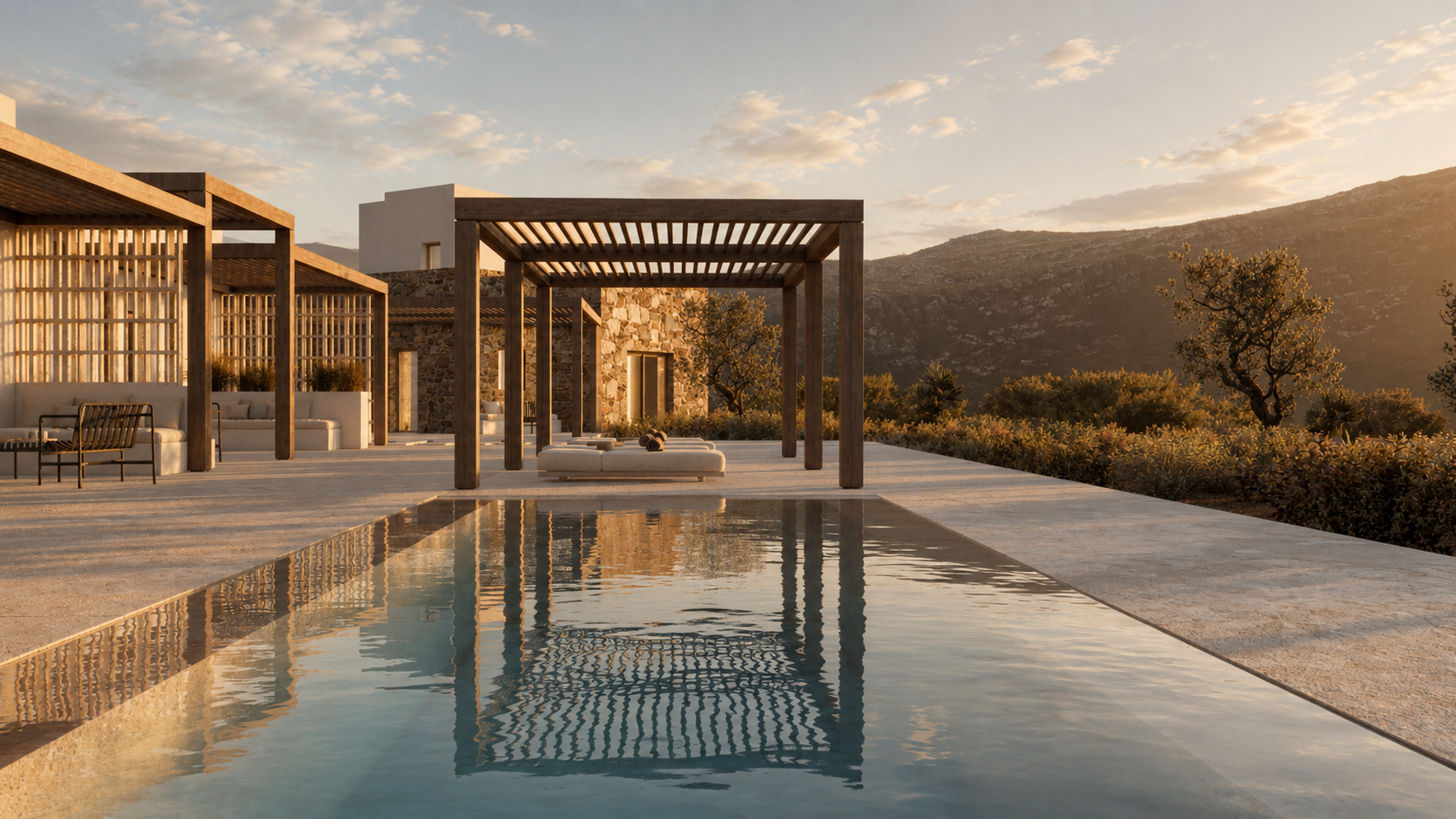 Modern outdoor patio with a swimming pool, wooden pergolas, and lounge seating, set against a landscape with mountains and trees during sunset.