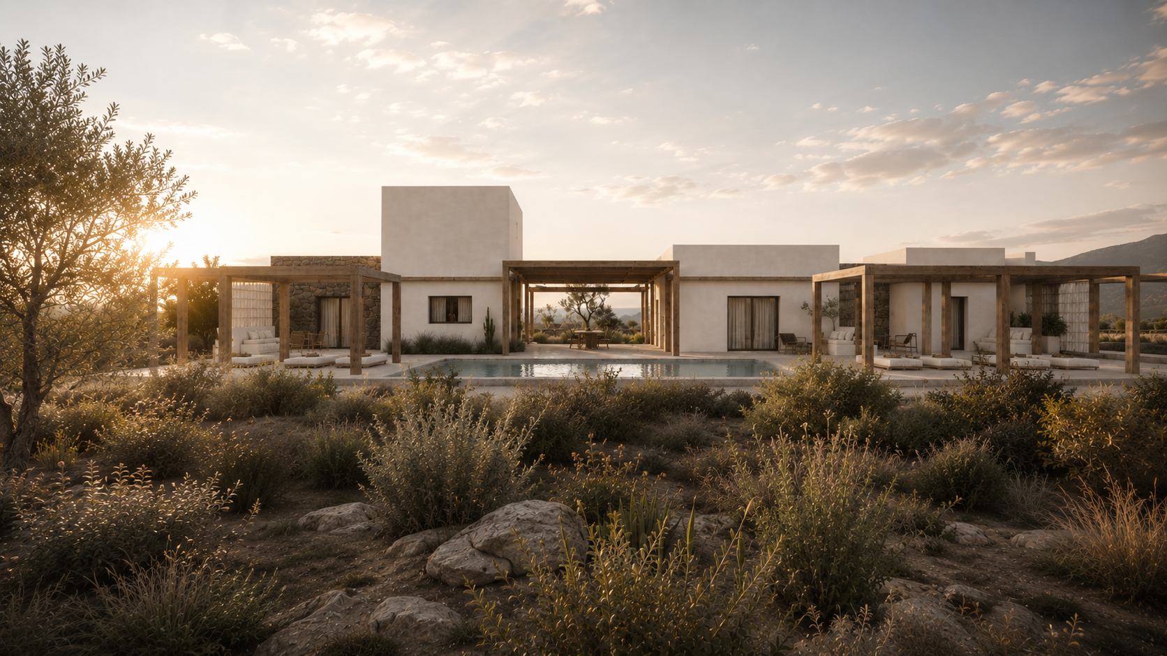 Modern desert house with white walls, wooden pergolas, and a swimming pool, set against a sunset with mountains in the background.