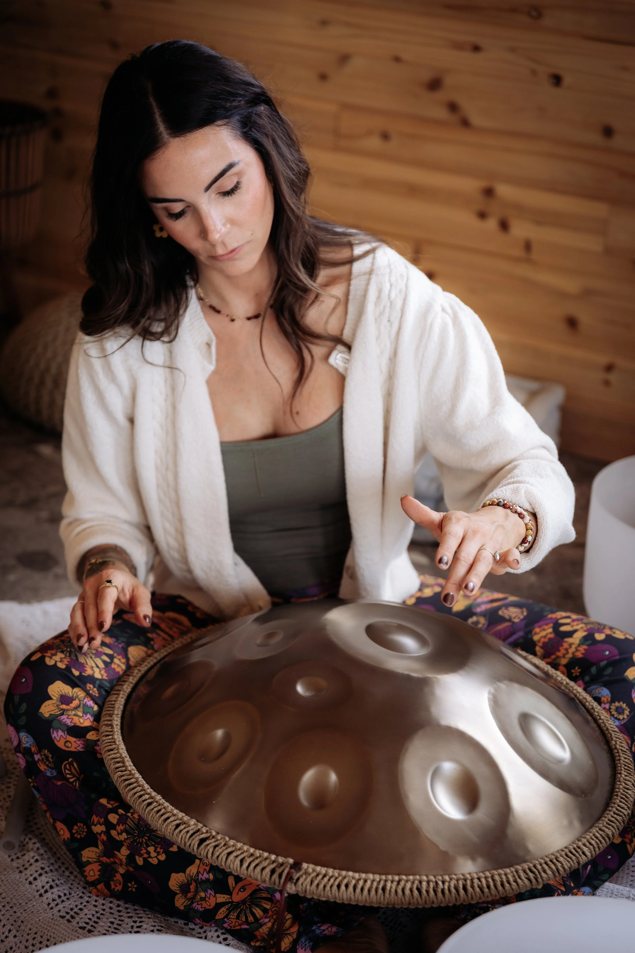 Tanya with a handpan during a sound healing class at Gathered Hearth in Prince Albert