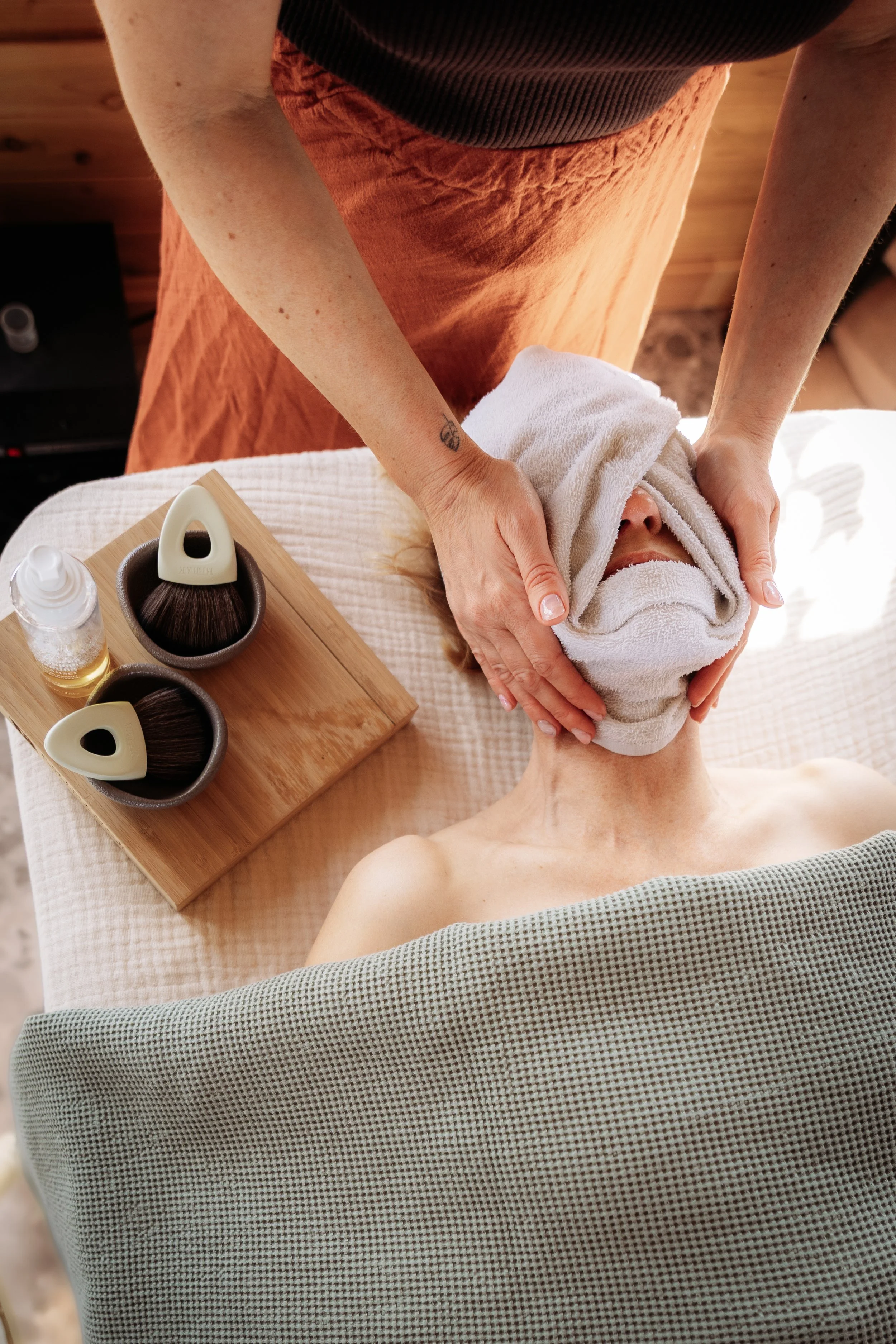 Client receiving a facial at Gathered Hearth in Prince Albert