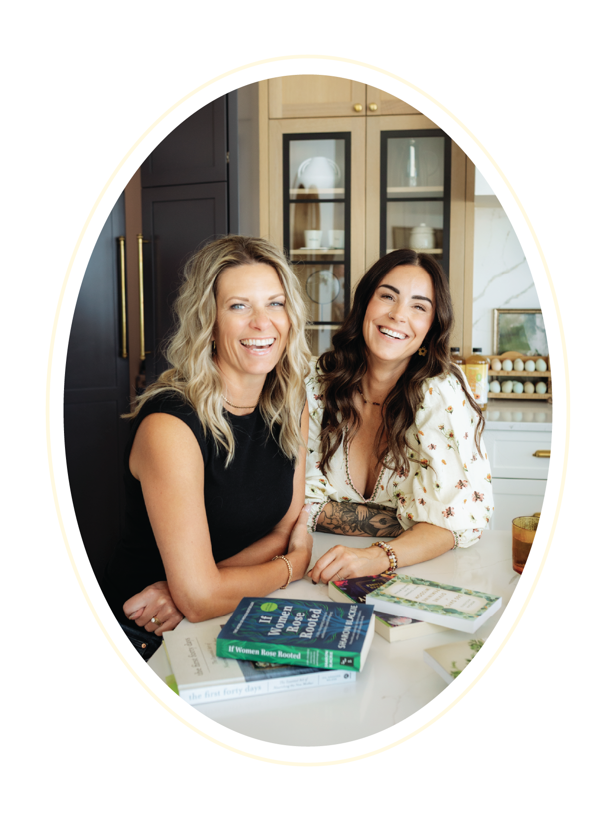 Jan and Tanya, co-founders of Gathered Hearth market and studio sitting together smiling