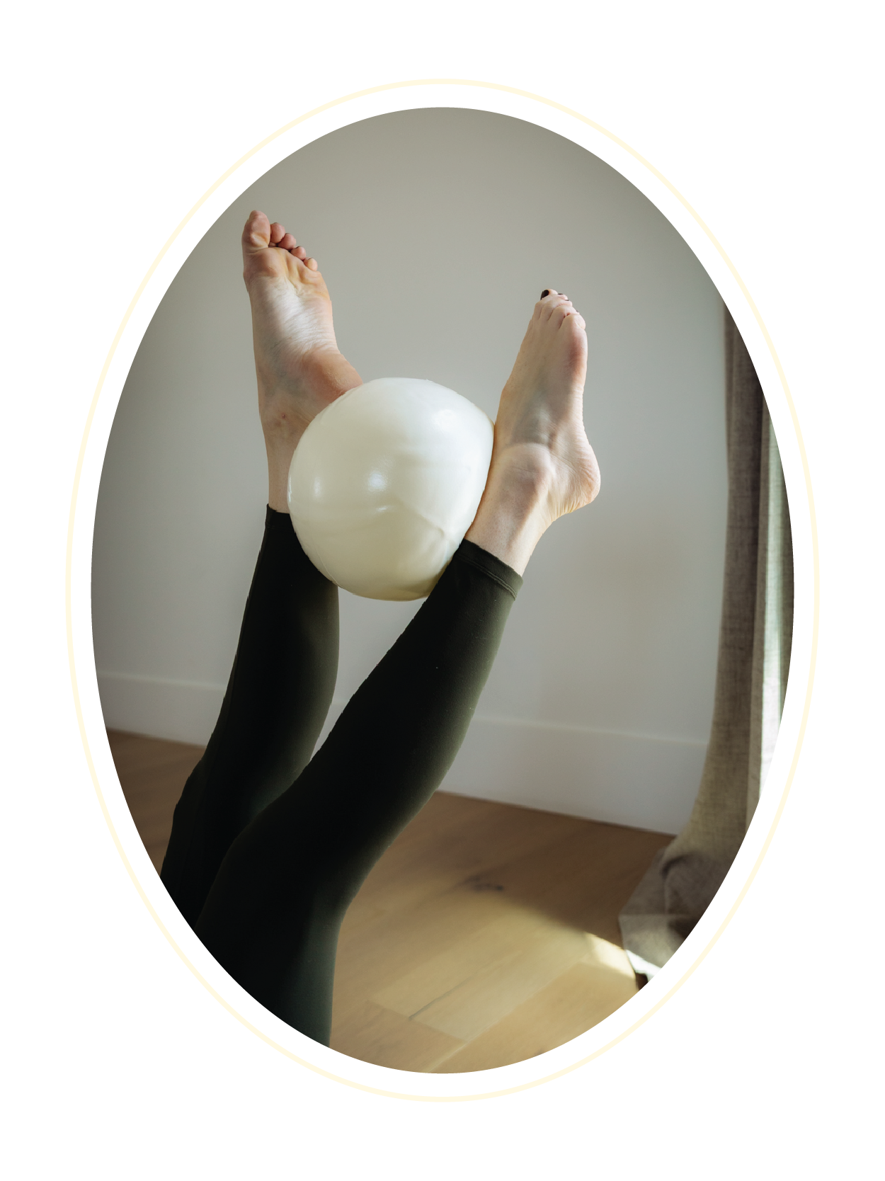 Participant performing a pilates move with a ball at Gathered Hearth Studio in Prince Albert