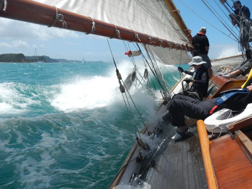 Waitangi pounding through the 2 metre swell behind Saddle Island.