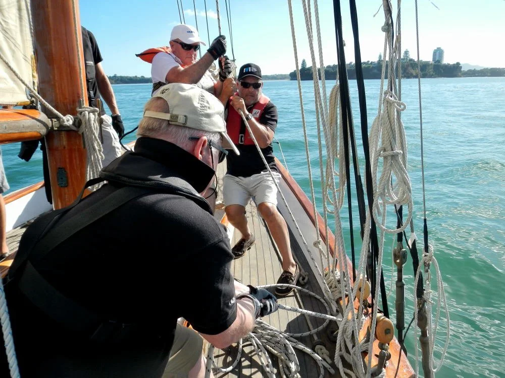 Hoisting the peak is a three man job.