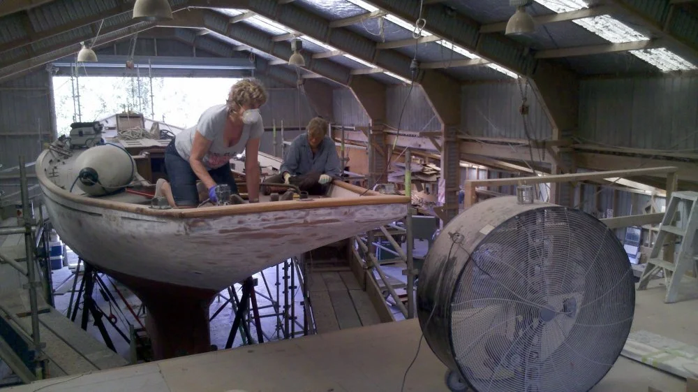 Rosey Williamson and Penelope Carroll starting on the deck sanding.