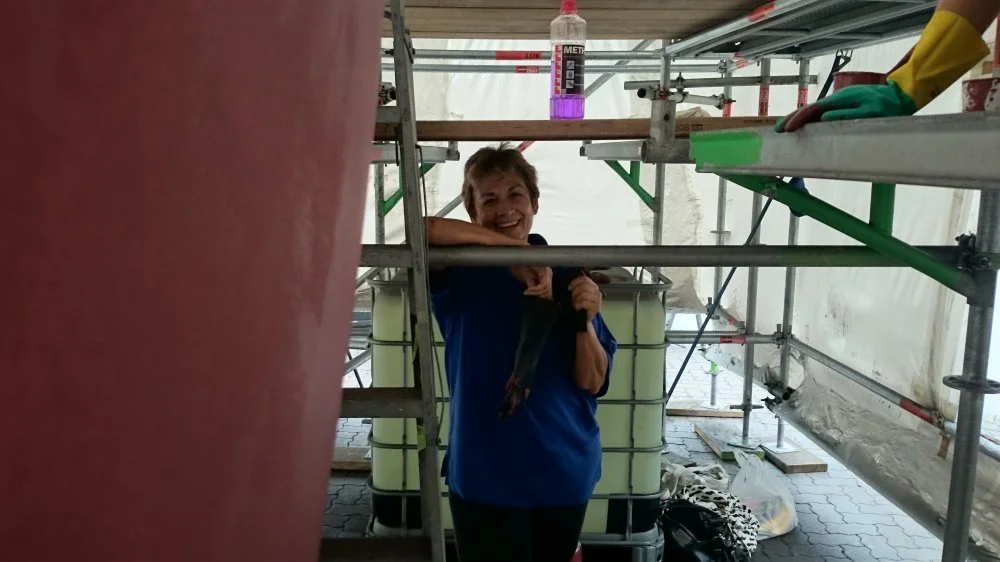 Crew member Robyn helping with the antifouling.