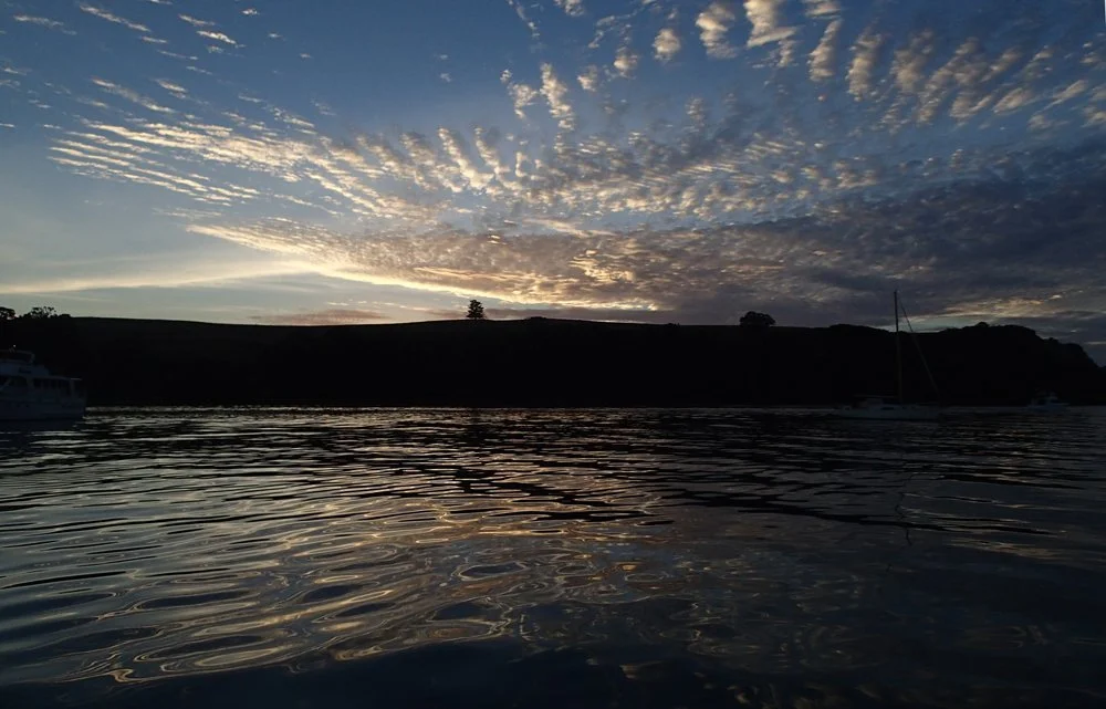 A tranquil Izzy Bay at dawn.