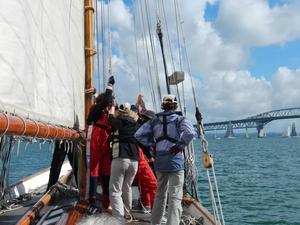 Many girls make light work of hoisting the topsail. Winter series. 