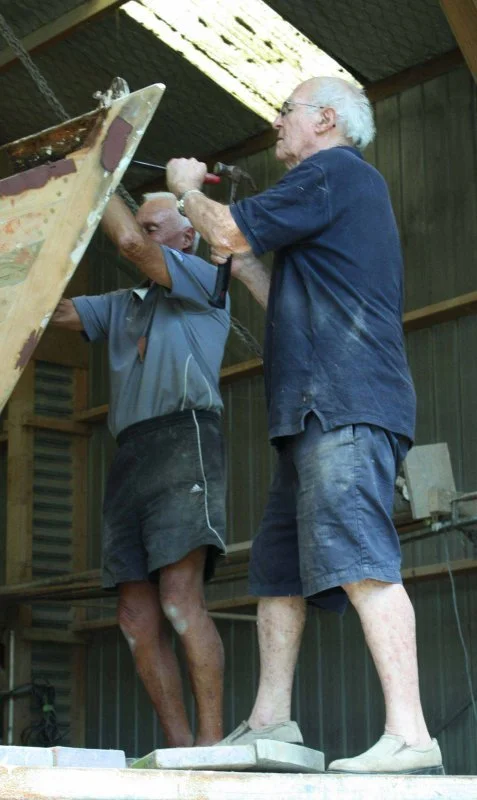 Max Carter and Roy Dixon stripping off Rainbow II.