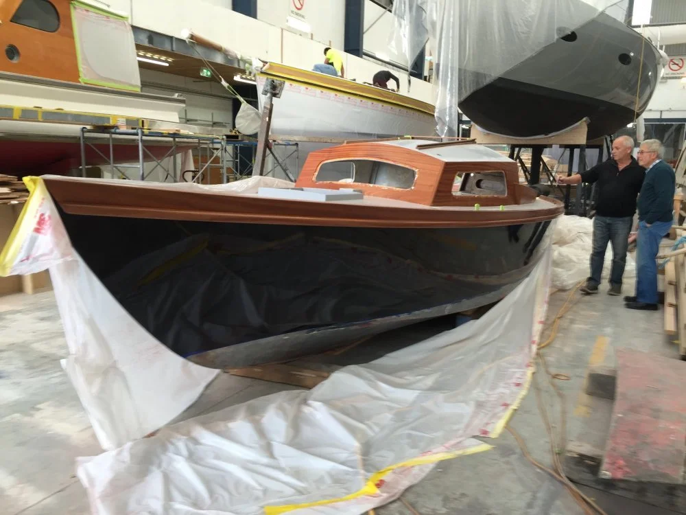 Ian Cook and Bruce Tantrum viewing restoration progress at Yachting Developments Ltd.