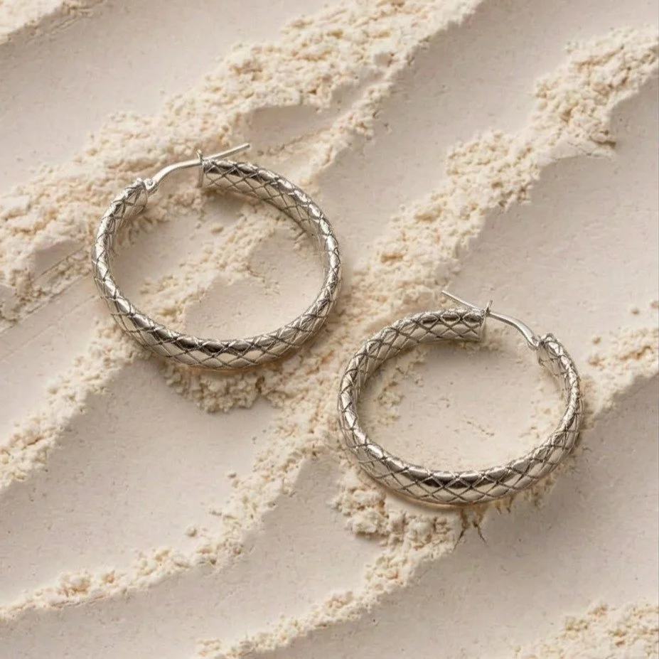 Silver essentials for the weekend. 

Our newest quilted hoops bring just enough edge to your everyday rotation. Lightweight, versatile, and finished with a unique diamond-pattern texture.

Come see how they catch the light at our pop-up tomorrow, May