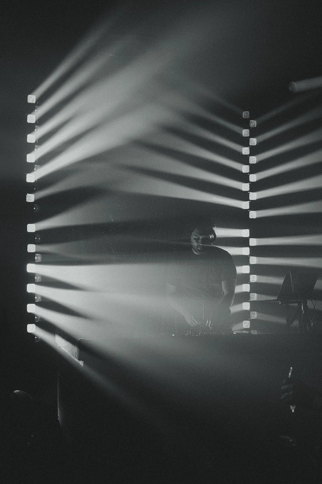 Mat the DJ mixing in a Parisian club with professional lighting on dancefloor in Paris