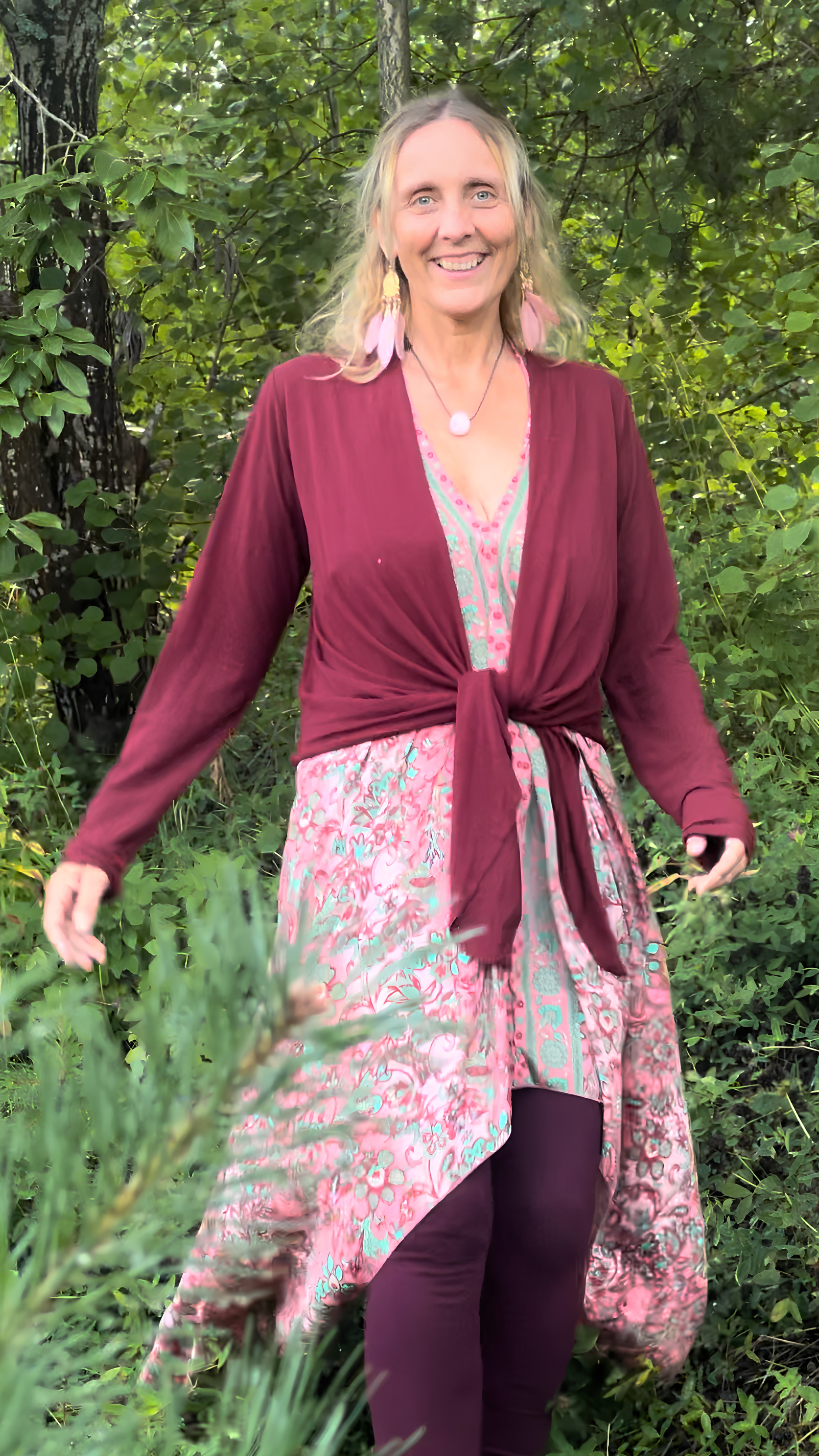 A grounding and alive picture of Annica Hill walking in the nature.