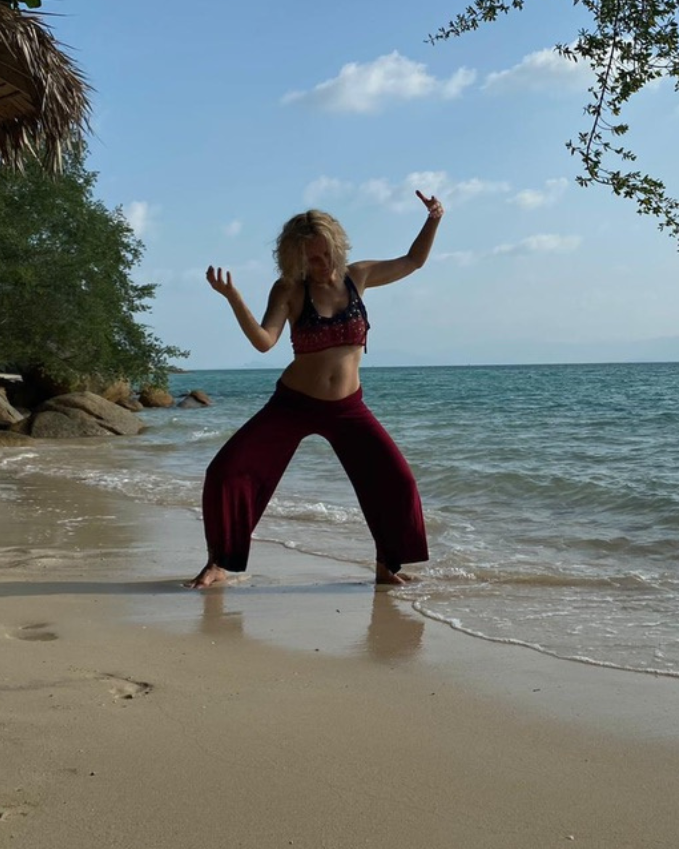 Annica Hill dancing on beach with peace and harmony around her.