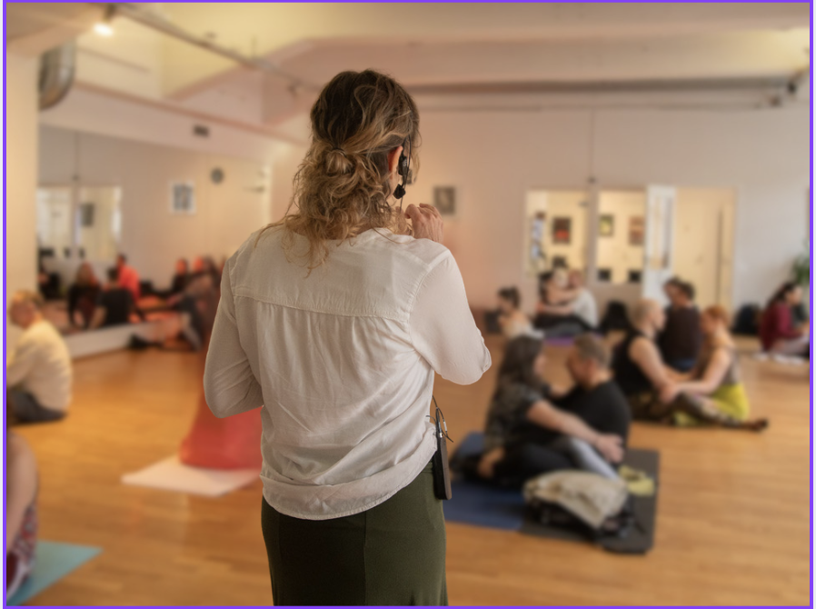 Couples practicing deep intimacy and conscious connection during a somatic relationship workshop with Annica Hill