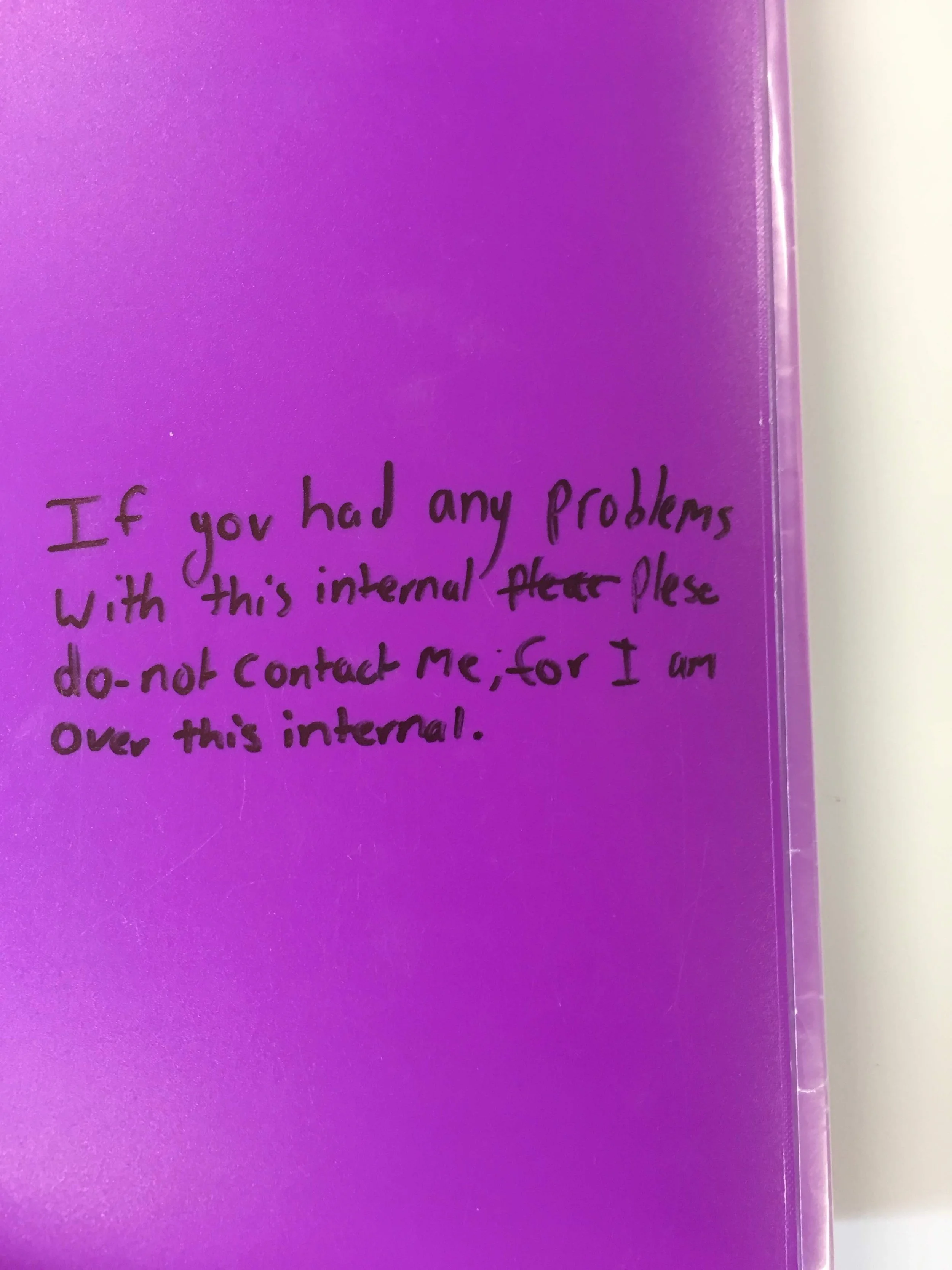 A purple folder from Grace's High School Years after a Year 11 History Internal with handwritten text on the front cover that reads, 'If you had any problems with this internal, please do not contact me, for I am over this internal.'