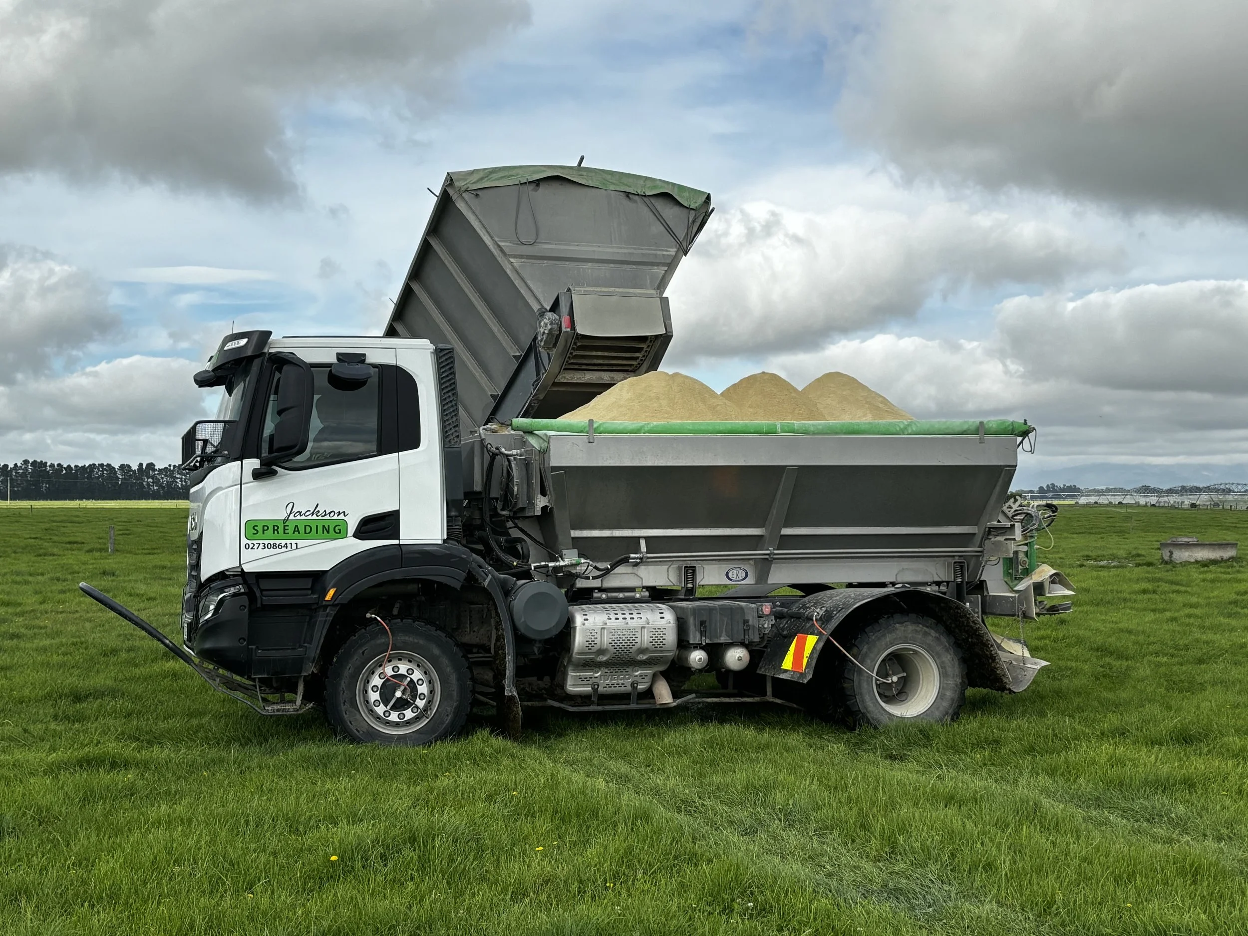 Jackson Spreading truck applying fertiliser - Mid Canterbury Groundspread fertiliser application Canterbury Plains