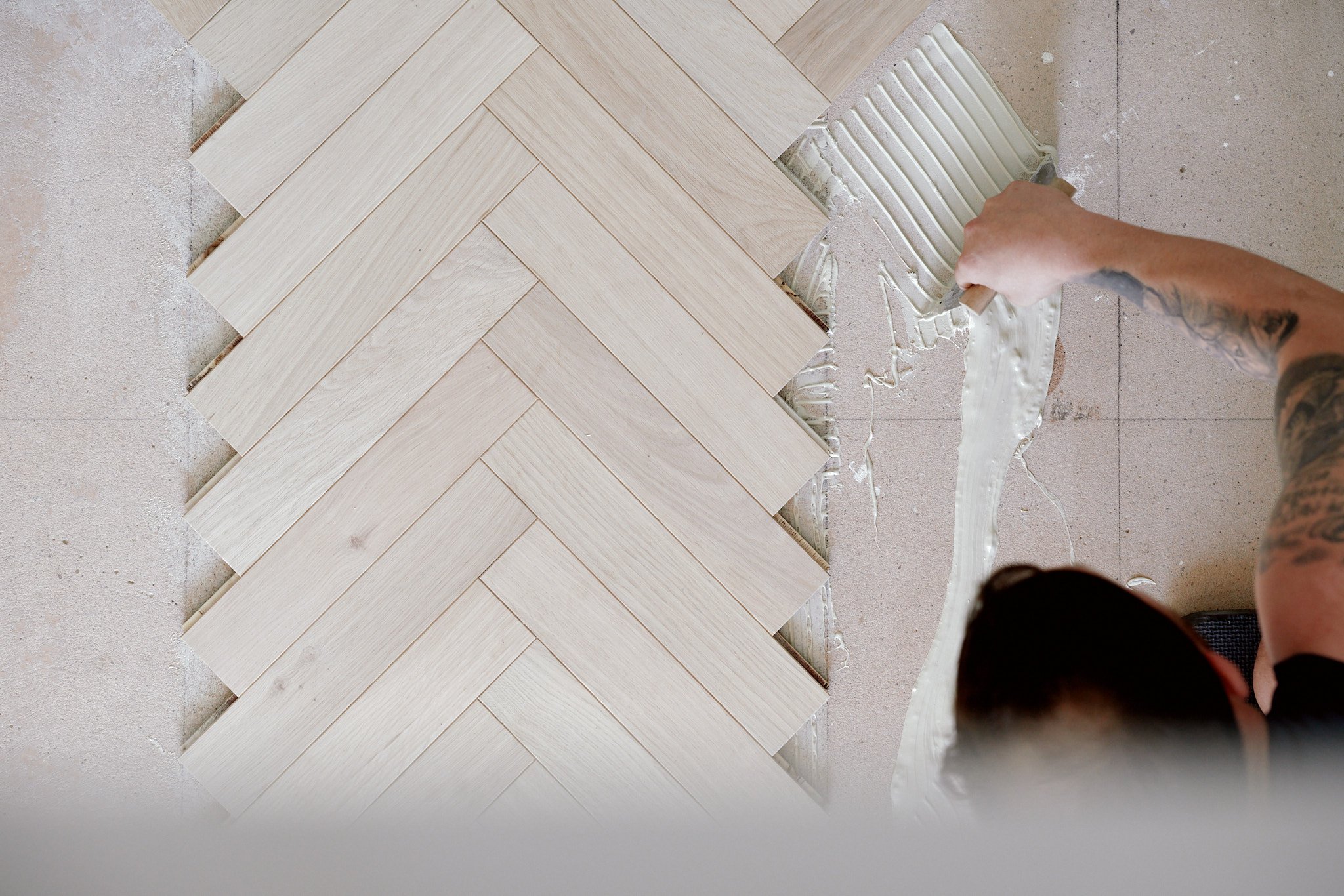 Laying a parquet floor, Tregelly - Passivhaus | Berryman Construction