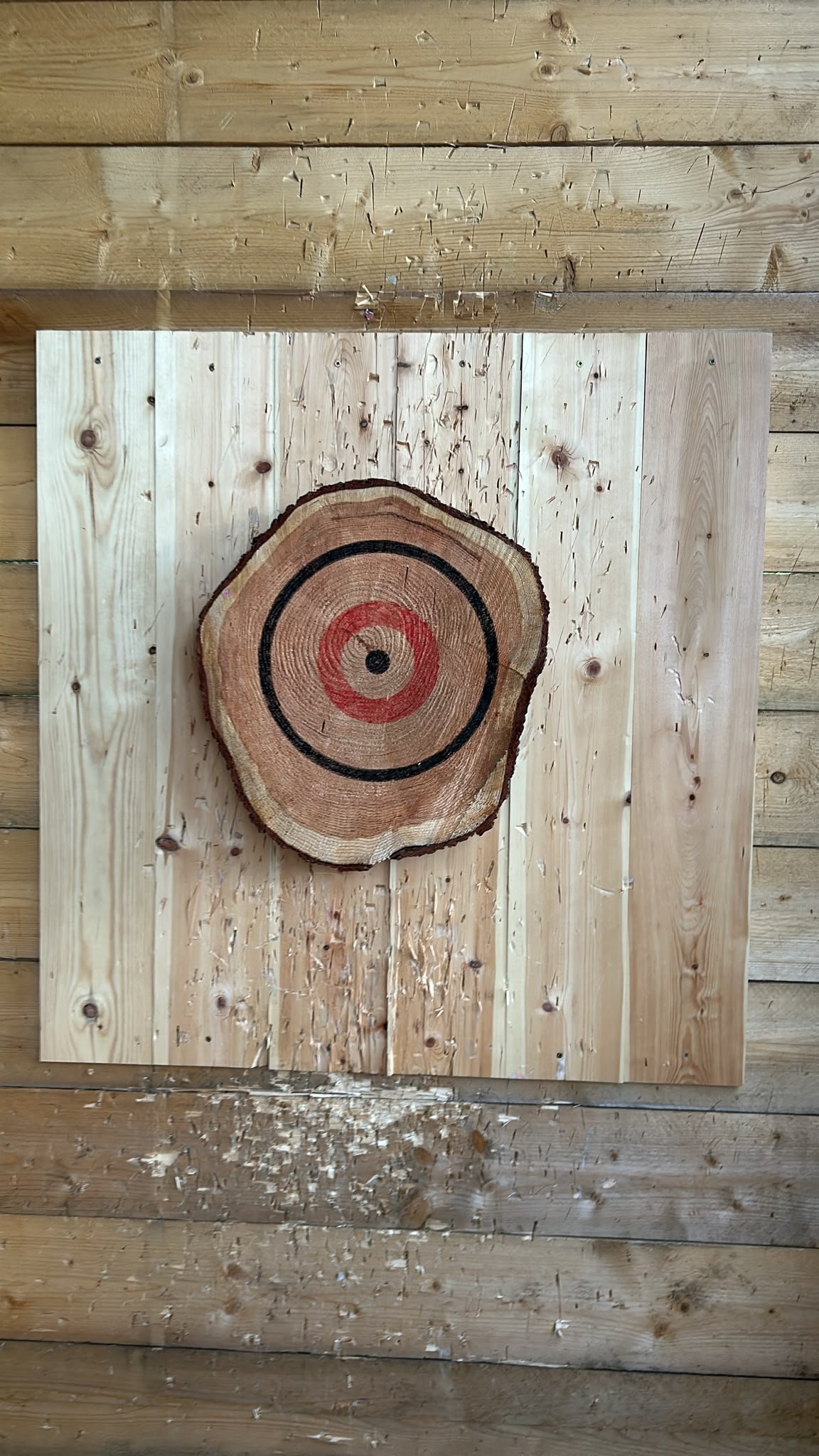 Wooden bullseye target in the covered throwing range at Bermuda Blades