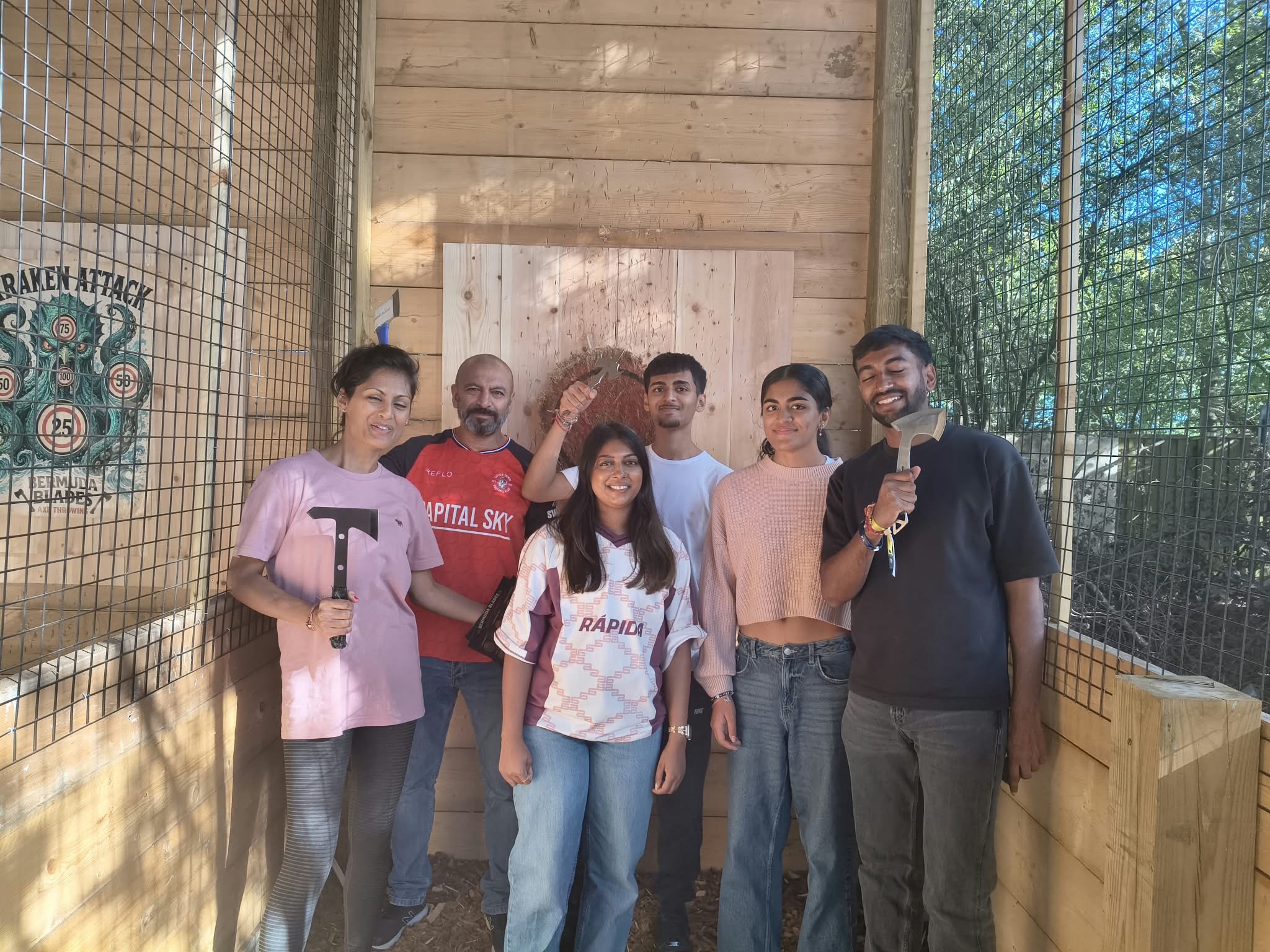 Guests enjoying a group axe throwing session at Bermuda Blades in Bedfordshire