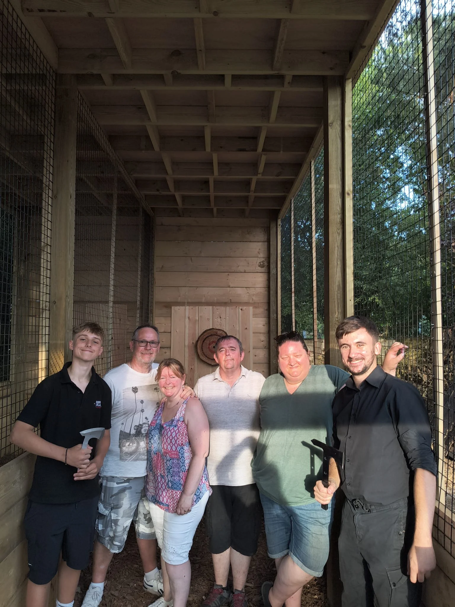Team enjoying a corporate axe throwing event at Bermuda Blades in Henlow, Bedfordshire.