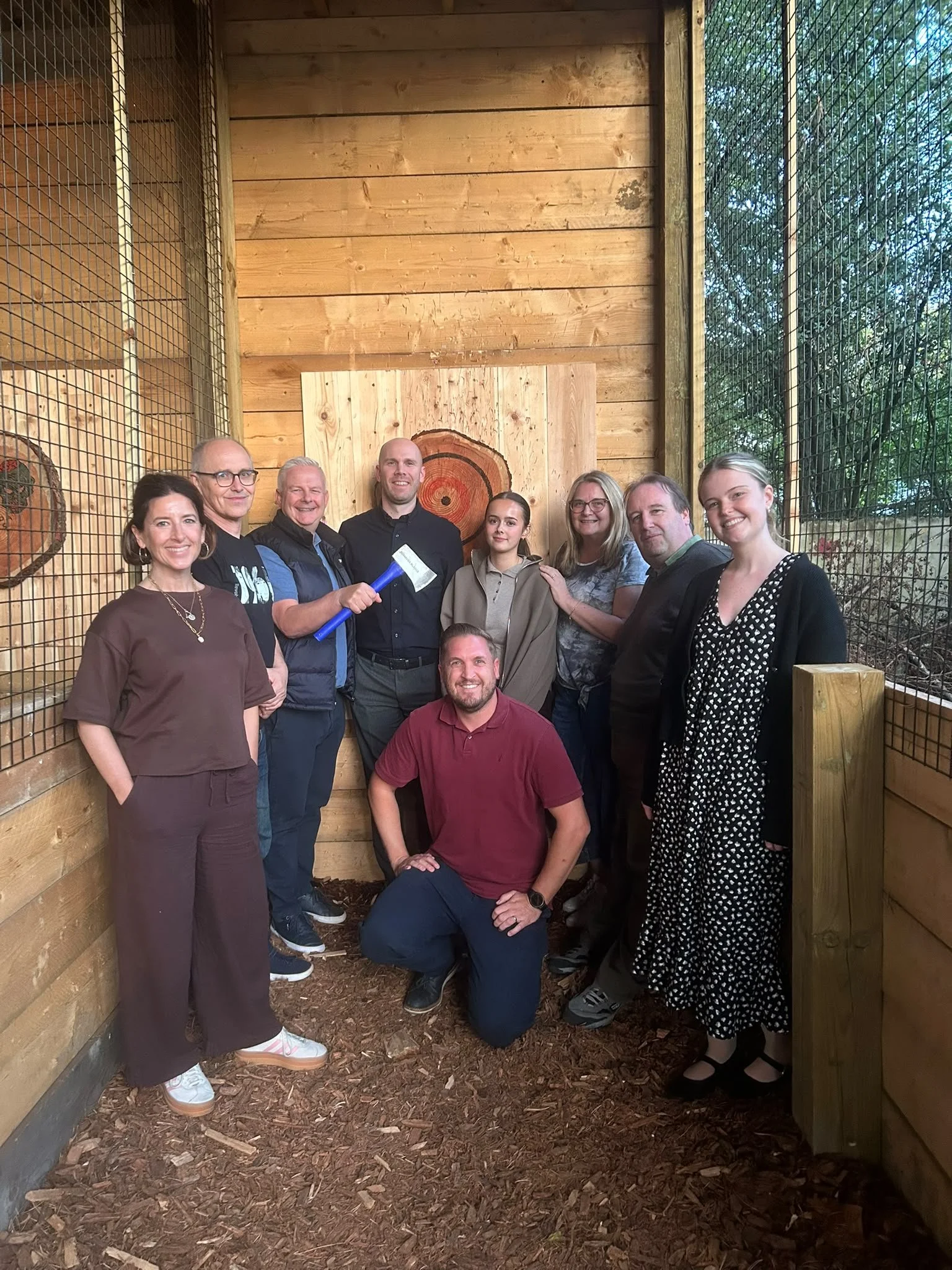 Nine guests enjoying a group axe throwing session at Bermuda Blades in Henlow, Bedfordshire