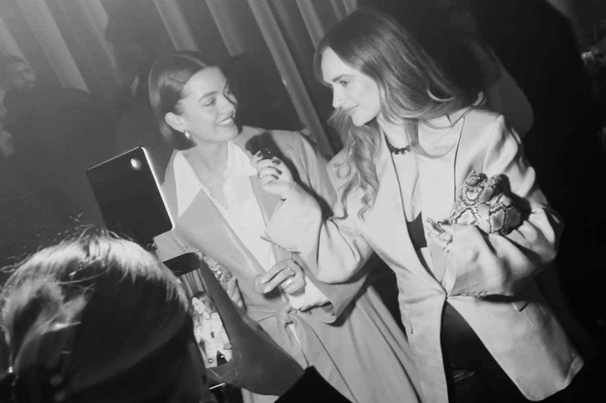Guest being interviewed on camera at a luxury brand event, captured by an event content creator