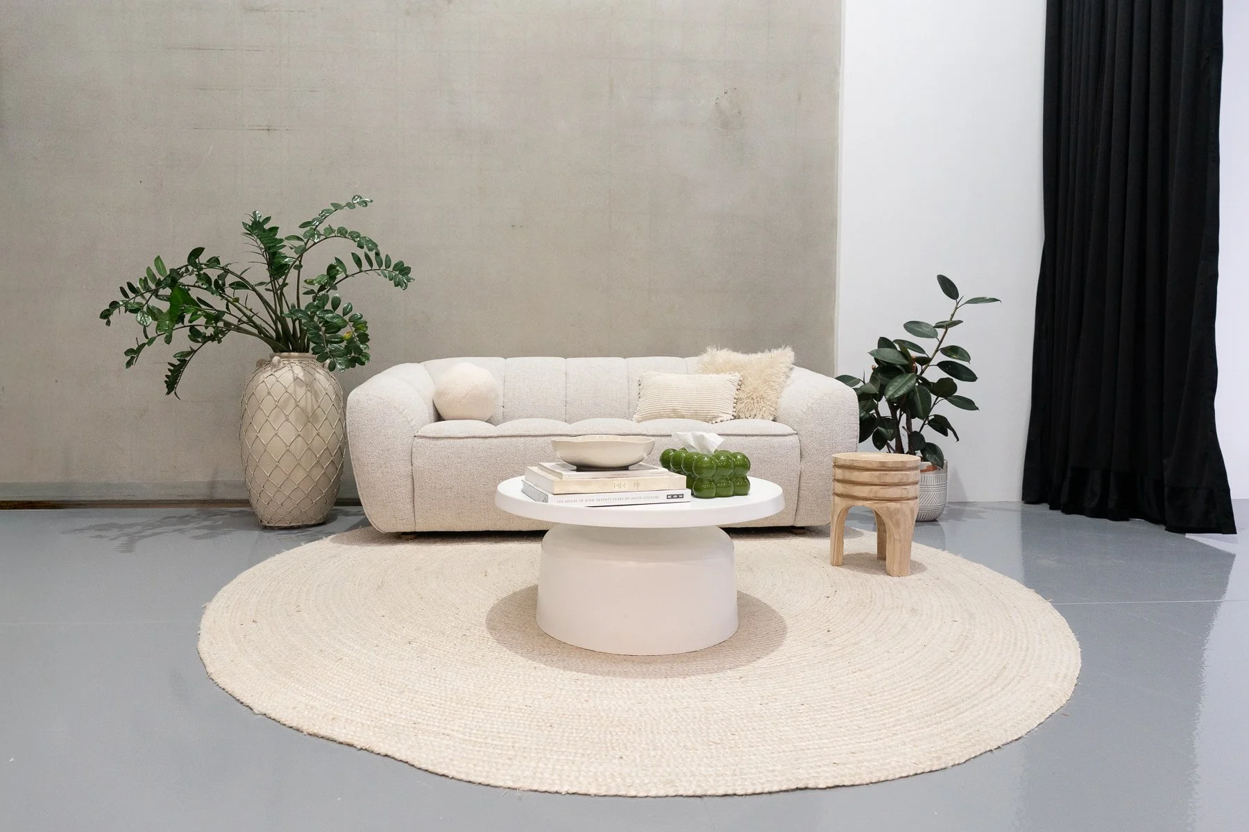 Light-coloured 2.5 seater sofa with a soft, textured finish and curved contemporary profile. A versatile neutral piece suited to fashion, lifestyle, portrait and interview setups.
