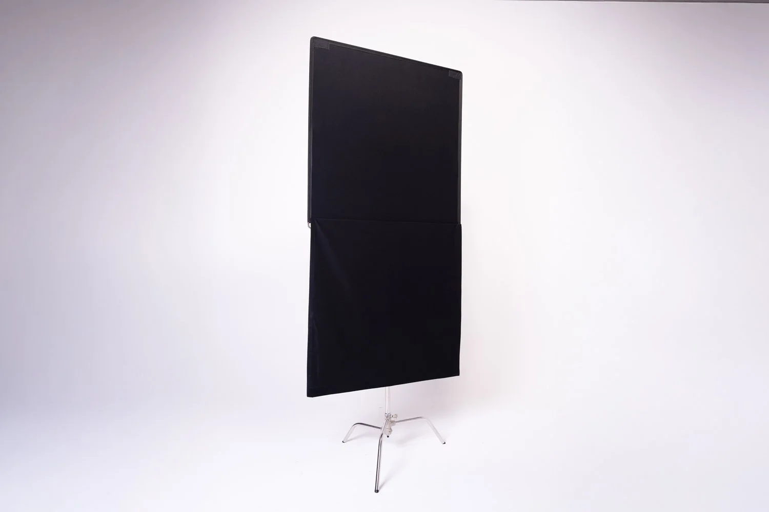 48 × 48" Black Floppy — professional black light-control flag for blocking unwanted spill, shaping light and creating negative fill to increase contrast. The hinged floppy section can be extended for additional coverage.