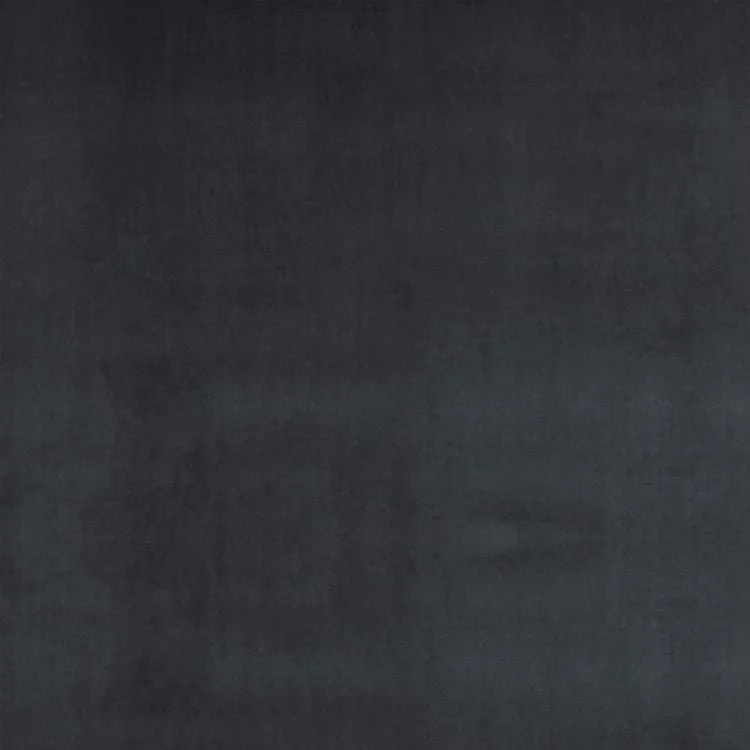 A solid dark grey textured surface, possibly a fabric or painted wall.