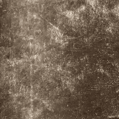 Close-up of a textured brown fabric surface.