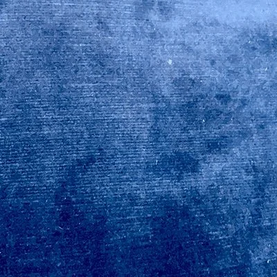 Close-up of denim fabric in dark blue color.