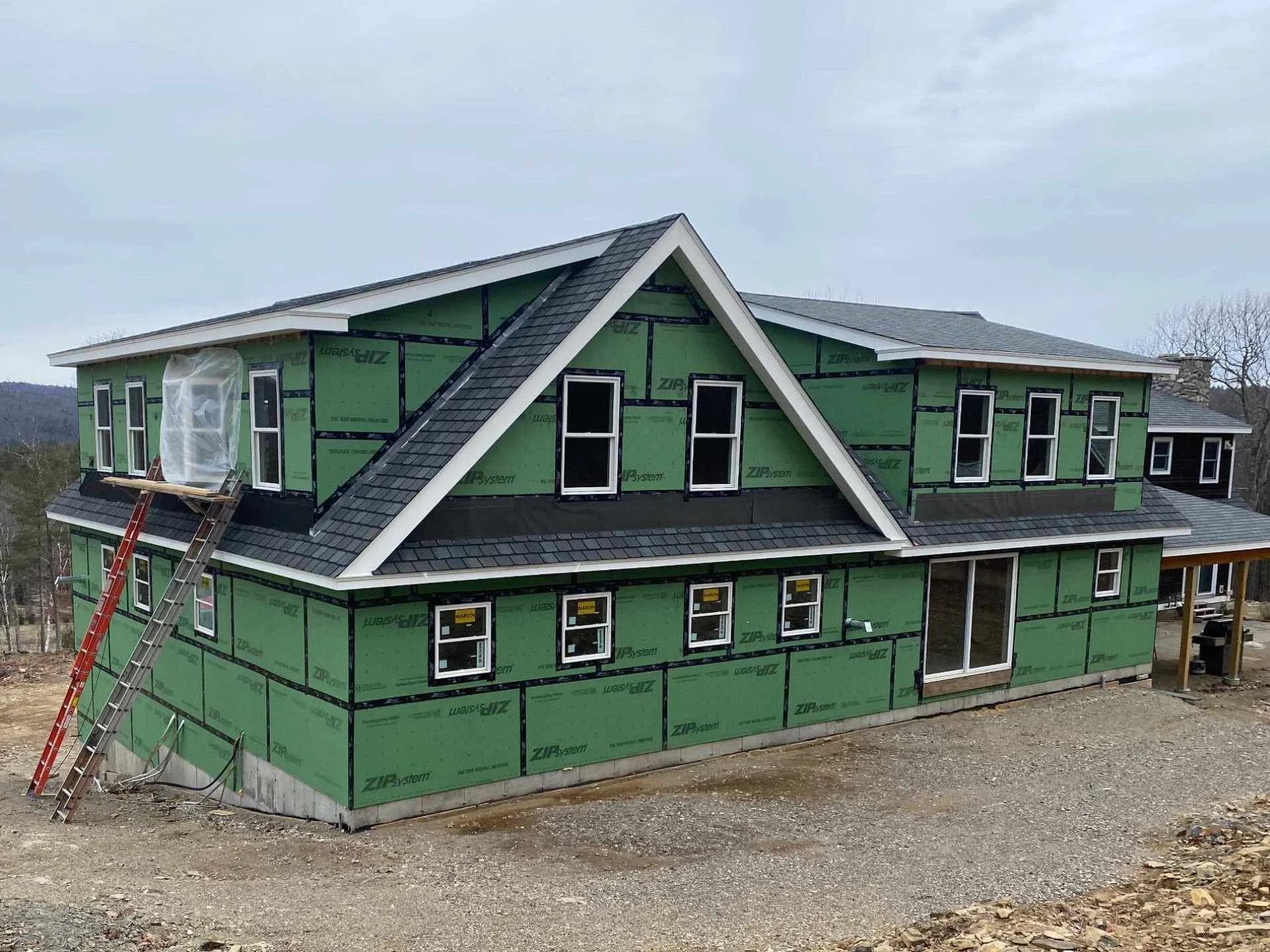 Newly build construction with ladders still in front of the structure